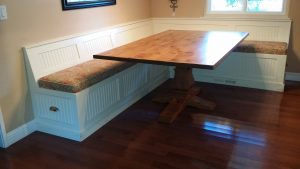 Table on p pedestal table with Custom banquette Seating